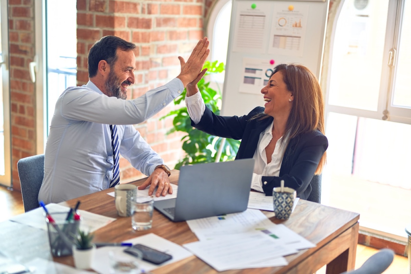 Property team celebrating a win in a meeting